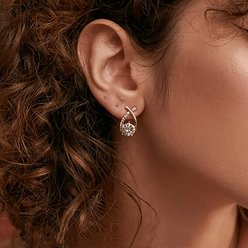Boucles d'oreilles avec une croix en or et des zircons