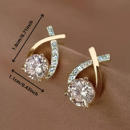 Boucles d'oreilles avec une croix en or et des zircons