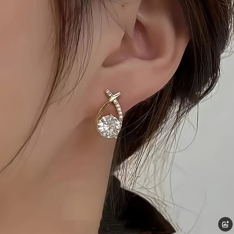 Boucles d'oreilles avec une croix en or et des zircons