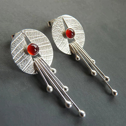Boucles d'oreilles avec pendentif en pierre creuse rouge