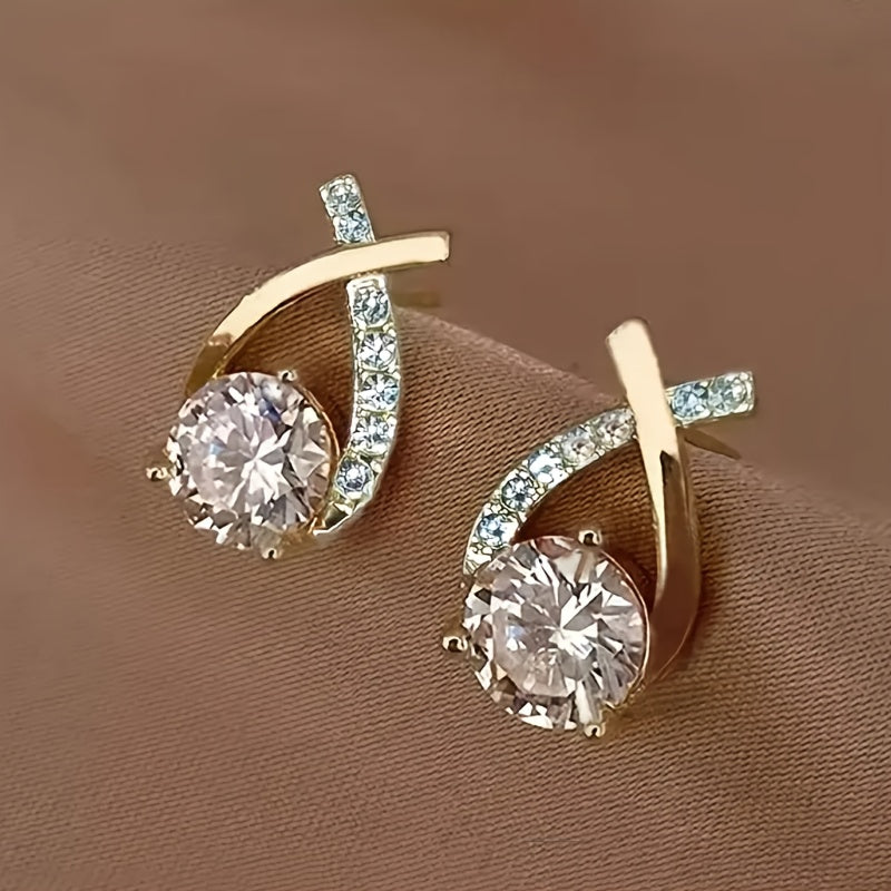 Boucles d'oreilles avec une croix en or et des zircons