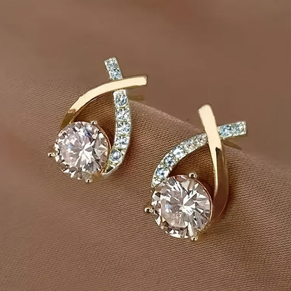 Boucles d'oreilles avec une croix en or et des zircons